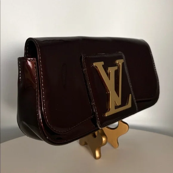 Louis Vuitton Burgundy Sobe clutch with Brass Hardware